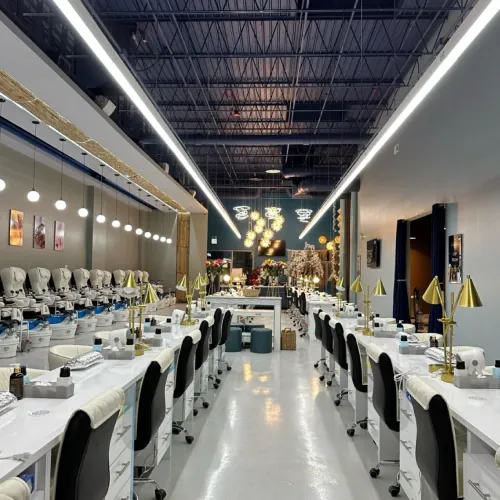 Luxo Nail Spa interior with pedicure stations on one side and manicure stations on the other
