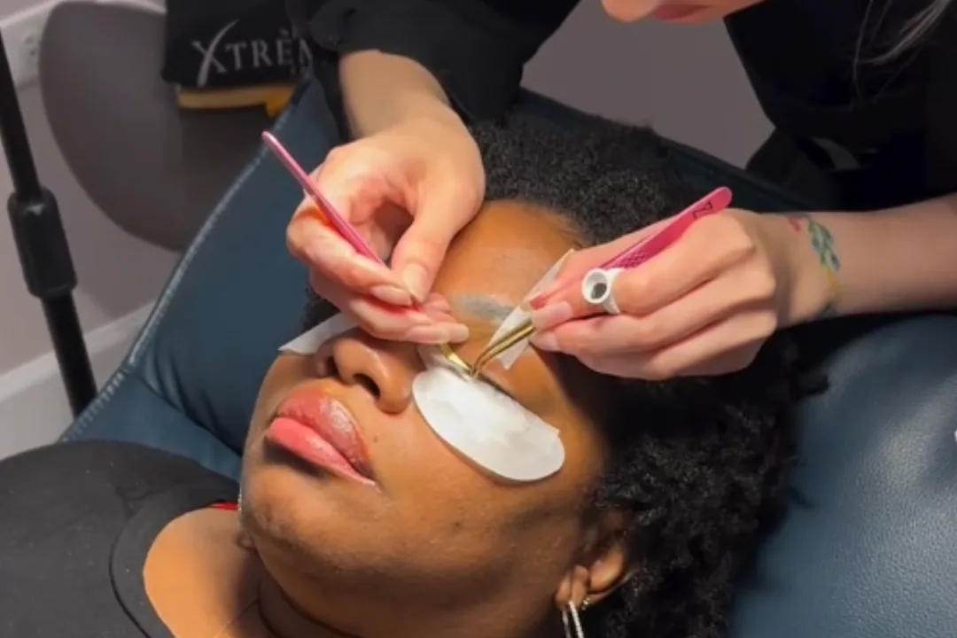 Lash extensions being applied