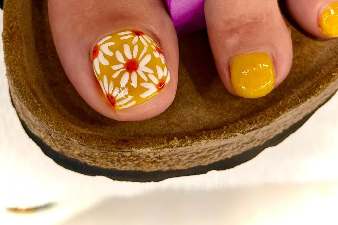 Yellow gel pedicure at Luxo Nail Spa in Avondale, Chicago